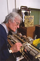 small photo of keith harding at his workbench